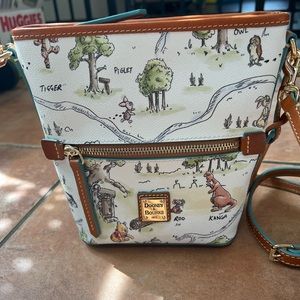 Dooney and Burke winning the Pooh hand bag Disney store special